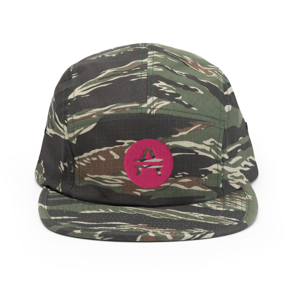 A camo 5 panel cap with an AMP Token AMP swagg alt-logo