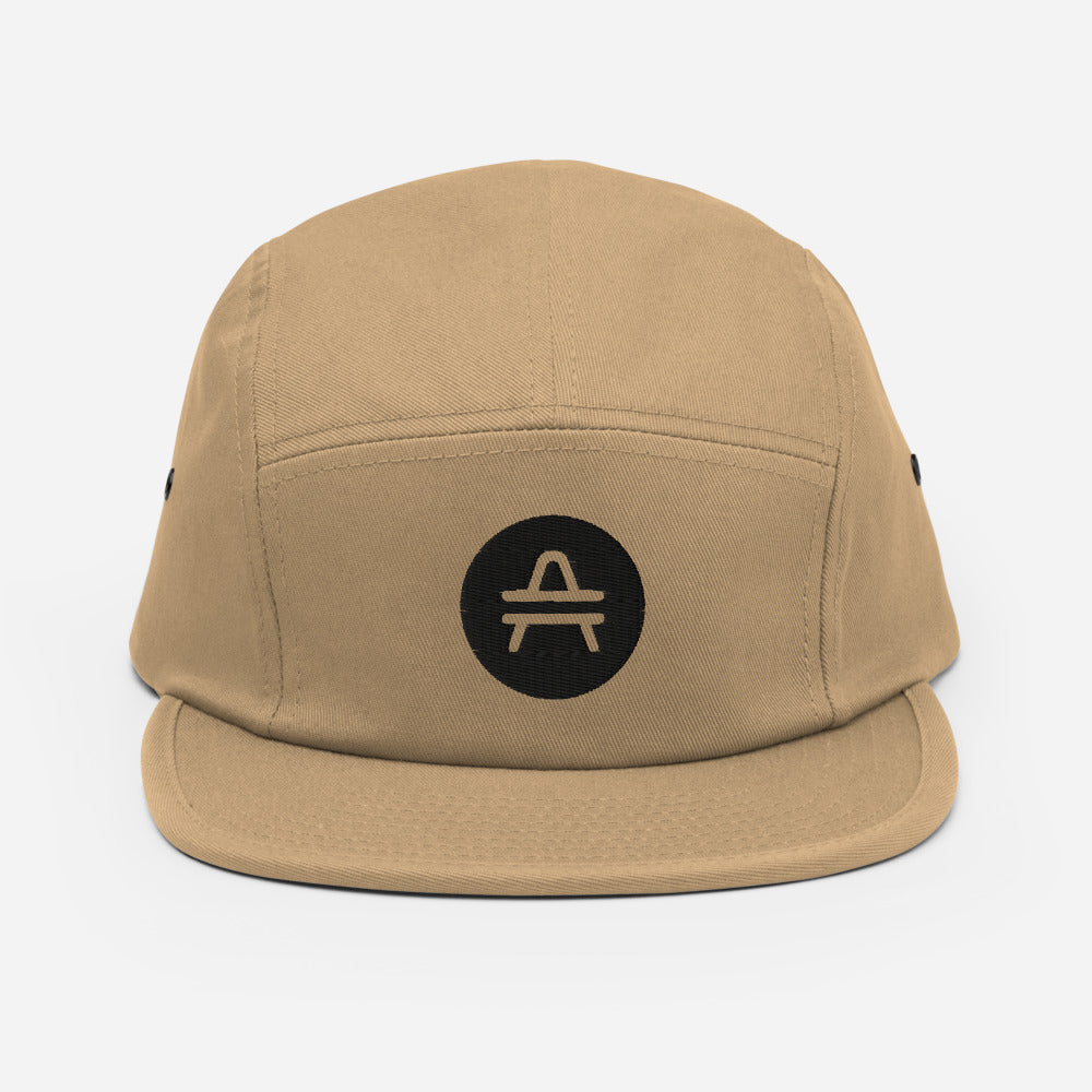 A khaki green 5 panel cap with an AMP Token AMP swagg alt-logo