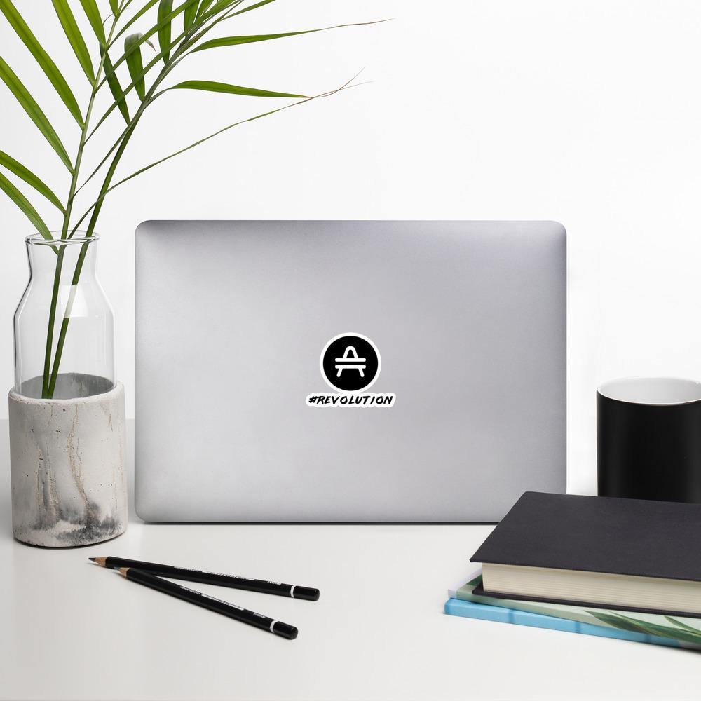 AMP Token Revolution Sticker in small size on a macbook