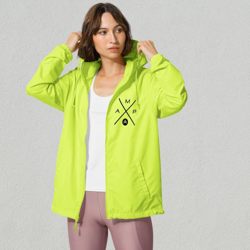 a woman rocking an amp swagg amp x windbreaker in neon yellow