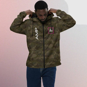 a man wearing an amp swagg vertices windbreaker in forest camo