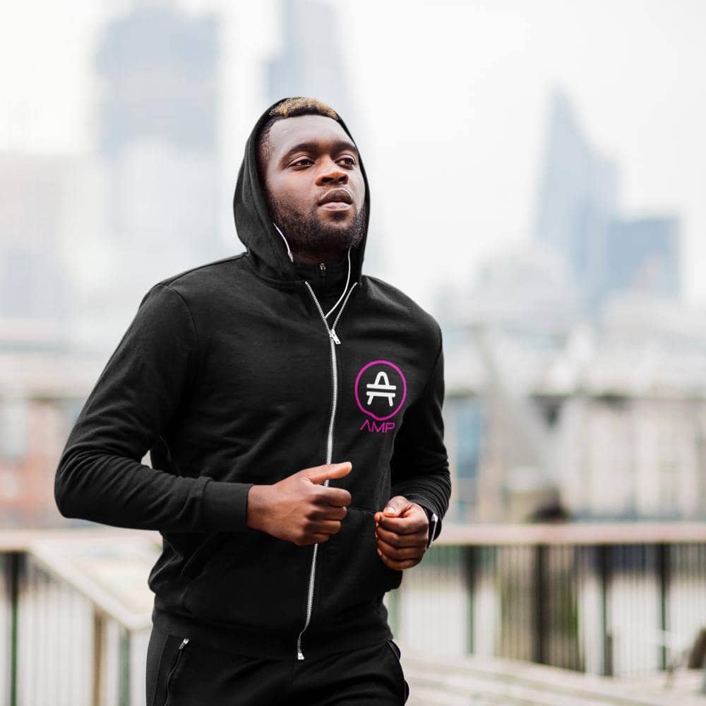 a man running in an AMP swagg stenciled lambda hoodie in black