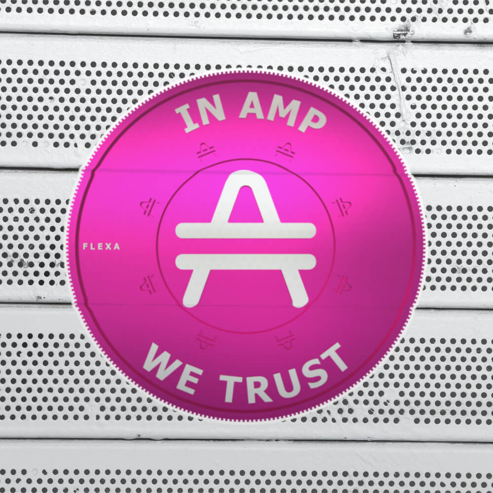 AMP Token 3D Ortho Sticker "In AMP We Trust" in a large size on a bench