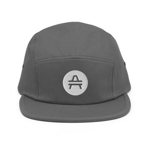 A grey 5 panel cap with an AMP Token AMP swagg alt-logo