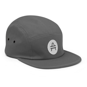 A grey 5 panel cap with an AMP Token AMP swagg alt-logo