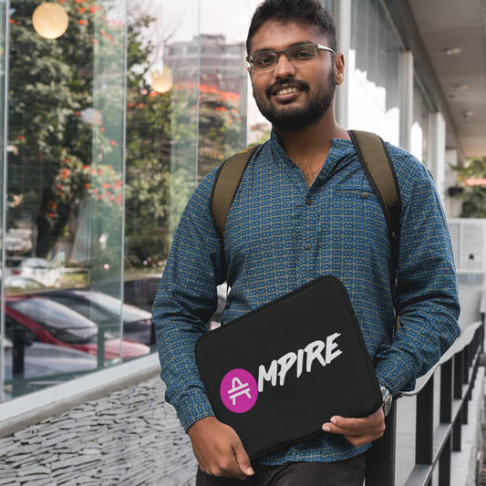 Man holding a black AMP Token AMP Swagg AMPIRE laptop sleeve