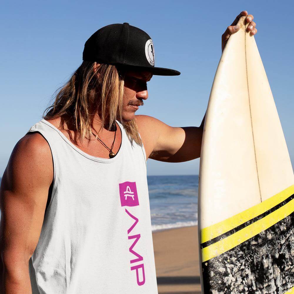 Male surfer wearing an AMP Token AMP Swagg Lambda Tank