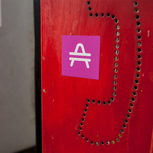 AMP Token Squared Alt-logo Sticker in a medium size on a red phone booth