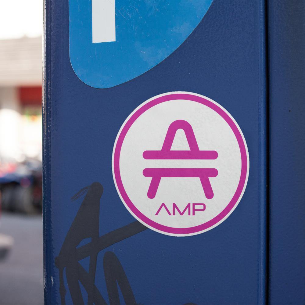 AMP Token Alt-logo Lambda Sticker in a large size stuck on a blue phone booth