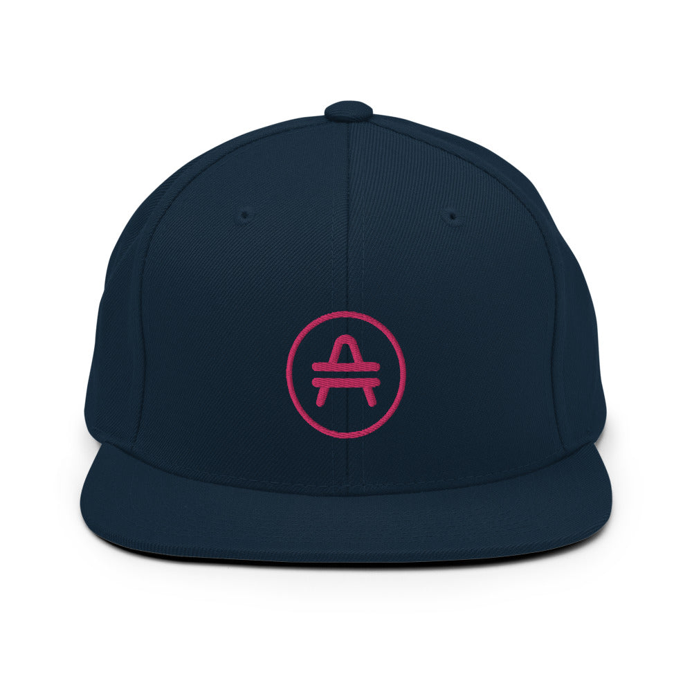 A dark navy AMP Token AMP swagg snapback hat