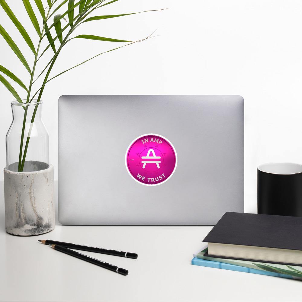 AMP Token 3D Ortho Sticker "In AMP We Trust" in a medium size on a macbook