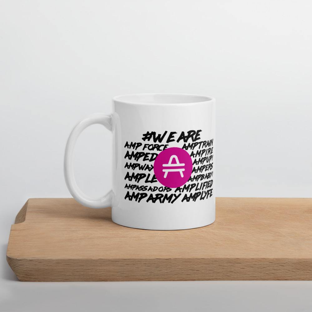 AMP Token White Mug #WE-ARE 11oz in white sitting on a shelf